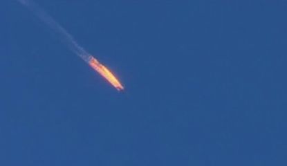A screengrab shows a Russia airplane falling from the sky after being struck by a Turkish missile