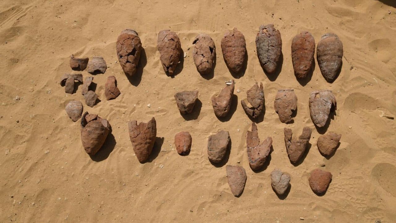 Here we see a large number of ancient Egyptian jars (around 22) in various states of disrepair lying on the sand. They were used to store beer. They&rsquo;re all a teardrop shape, with the widest end at the top.