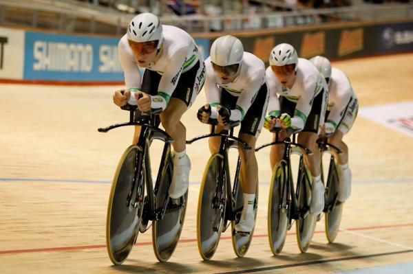 The Australian team pursuit team down the back straight.