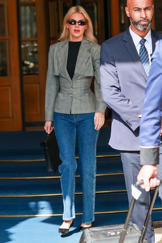 Kendall Jenner wearing a checked blazer and straight-leg jeans