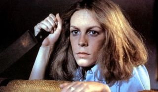 Halloween (1978) Jamie Lee Curtis Laurie hides behind the couch with a knife