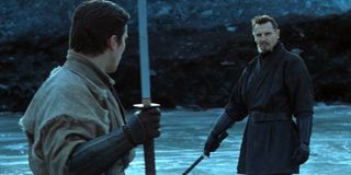 Bruce Wayne (Christian Bale) and Henri Ducard (Liam Neeson) face off in Batman Begins (2005)