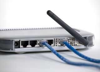 A router with two blue wires inserted