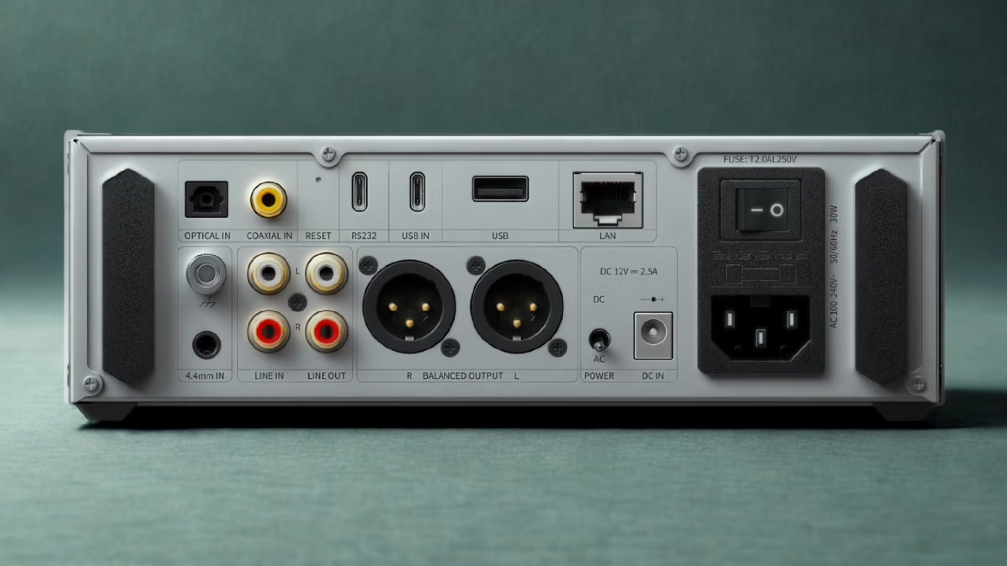 Product shot of the FiiO K15 desktop DAC against a neutral background. The K15 is shot from behind to show its connectors.