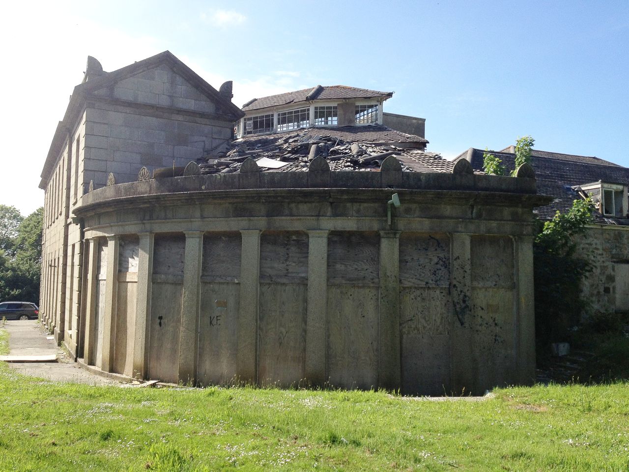 The rotting veneer of the building before renovation