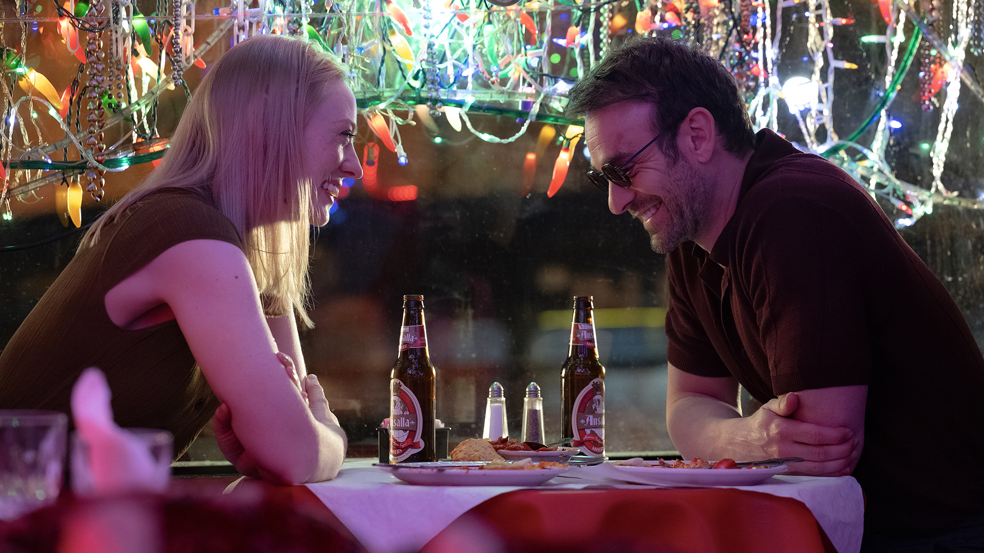 Karen and Matt smiling during a dinner date in Daredevil: Born Again season 2 episode 8