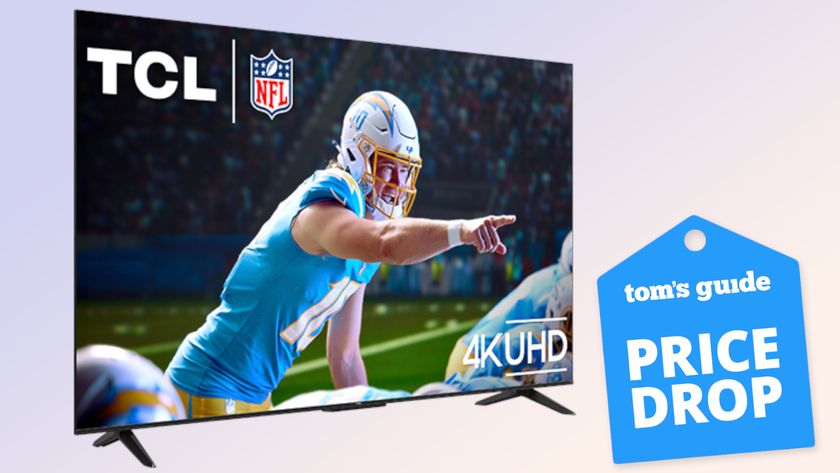 The TCL S5 LED TV displaying a scene in which a football quarterback calling a play. Next to the TV is a floating badge that reads: &quot;Tom&#039;s Guide Price Drop&quot;