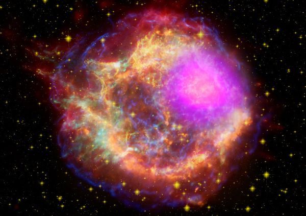 Gamma rays (magenta) blast out of the Cassiopeia A supernova remnant in this composite satellite image. New research suggests the most mysterious gamma-ray bursts in the universe may form in a similar way.