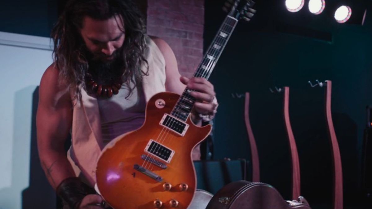 Jason Momoa inspects Slash’s Jessica Les Paul in On The Roam