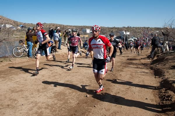 A steady stream of riders flows along the Le Mans start at the Kona Bikes 24 Hours in the Old Pueblo race.