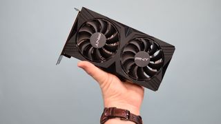 A PNY GeForce RTX 4060 Verto graphics card being held aloft