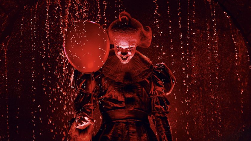 Pennywise holding red balloon in poster for IT: Welcome to Derry