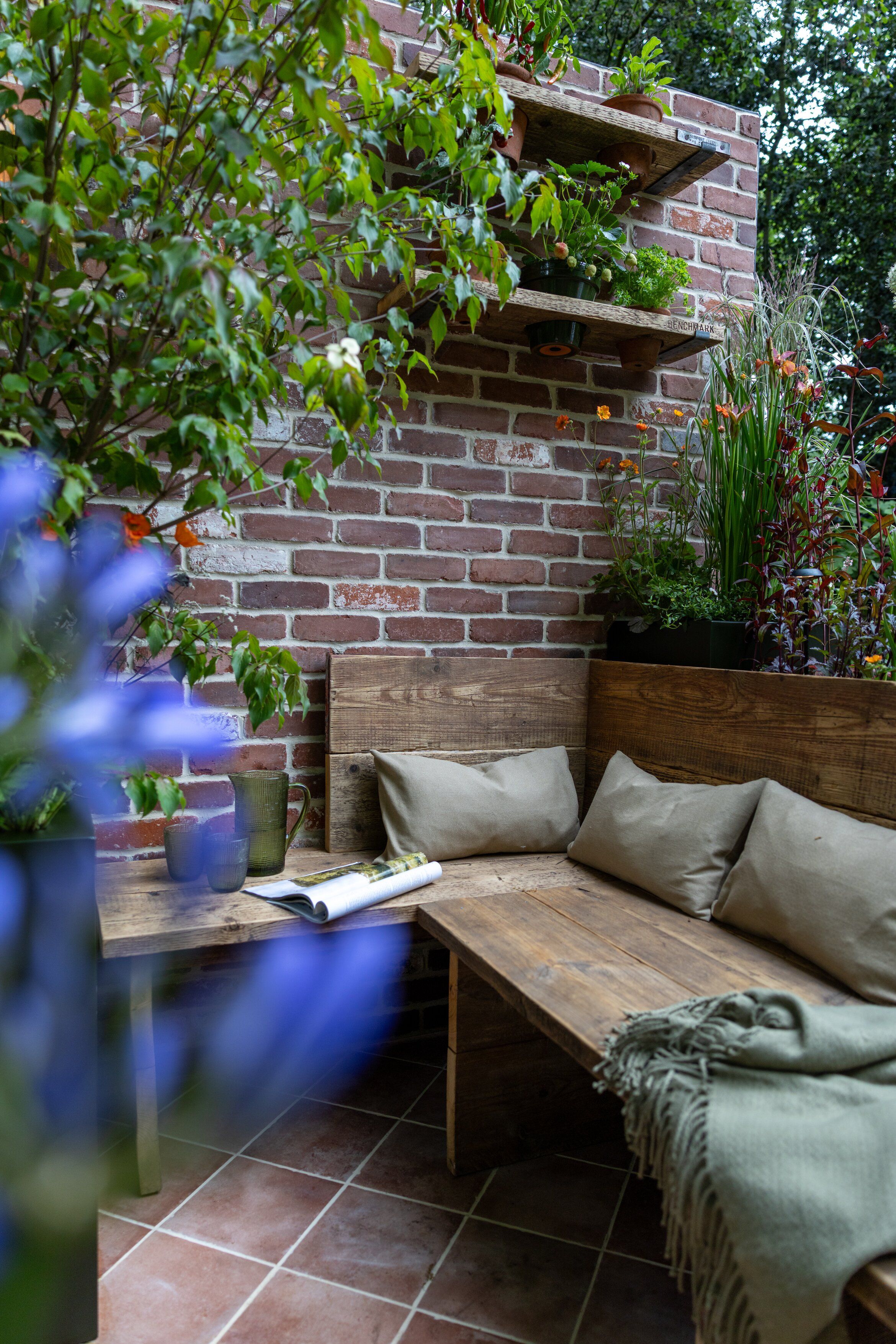 Images and details showing the planting and structure of the transient garden. Lots of brick, leafy greens and brushed metal