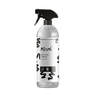 Grey bottle of Miniml vinegar with a black lid on a white background