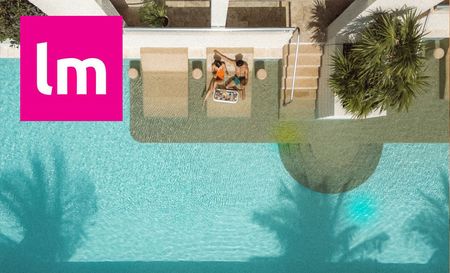 couple enjoying by the pool on a holiday booked from lastminute website