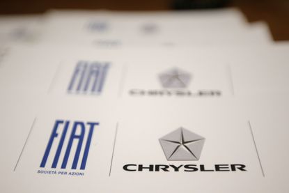 A paper with Fiat and Chrysler logos.