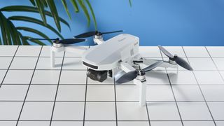 A gray Potensic Atom 4K drone