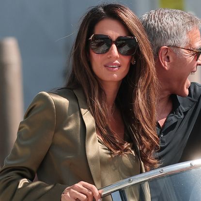 Amal Clooney arrived at the 2026 Venice Film Festival in a silky pair of shorts layered beneath a blazer