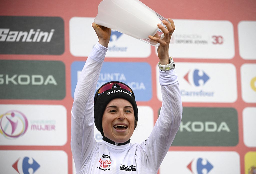 Third placed of 2026 La Vuelta Femenina cycling tour of Spain, team Team Visma - Lease a Bike's French rider Marion Bunel celebrates on the podium after the 7th stage, a 132.9 km race between Pola de Laviana and Alto de l'Angliru, on May 9, 2026. (Photo by Miguel RIOPA / AFP via Getty Images)