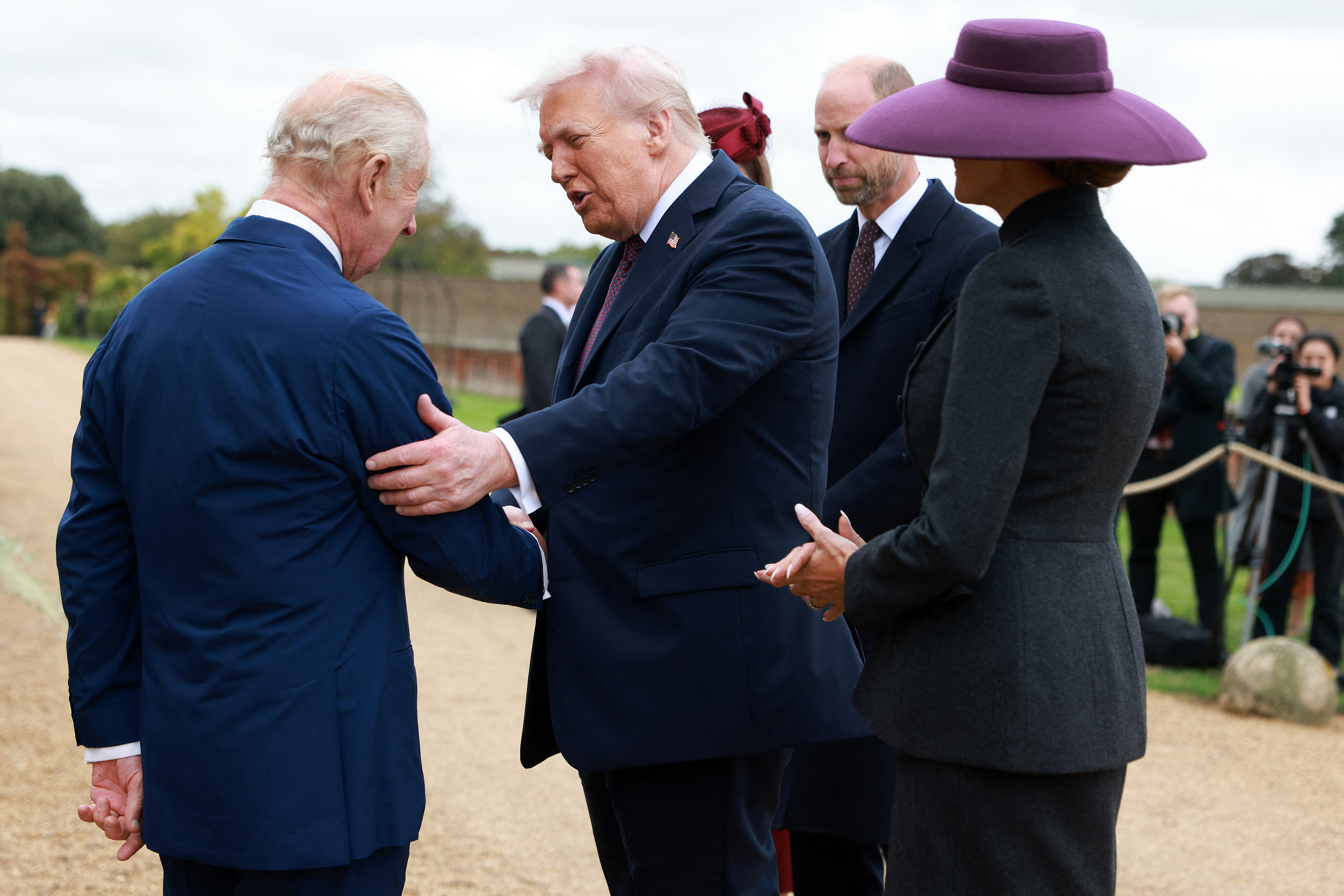 Britain&#039;s King Charles III and Britain&#039;s Queen Camilla greet US President Donald Trump and First Lady Melania Trump, accompanied by Britain&#039;s Prince William, Prince of Wales and Britain&#039;s Catherine, Princess of Wales, upon their arrival in the grounds of Windsor Castle, in Windsor, on September 17, 2025, for the start of a second State Visit. US President Donald Trump arrived in Britain for an unprecedented second State Visit, with the UK government rolling out a royal red carpet welcome to win over the mercurial leader. (Photo by Ian Vogler / POOL / AFP)