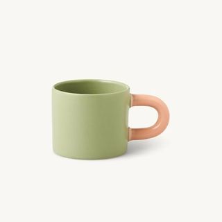 Sostrene Grene green mug with pink handle.