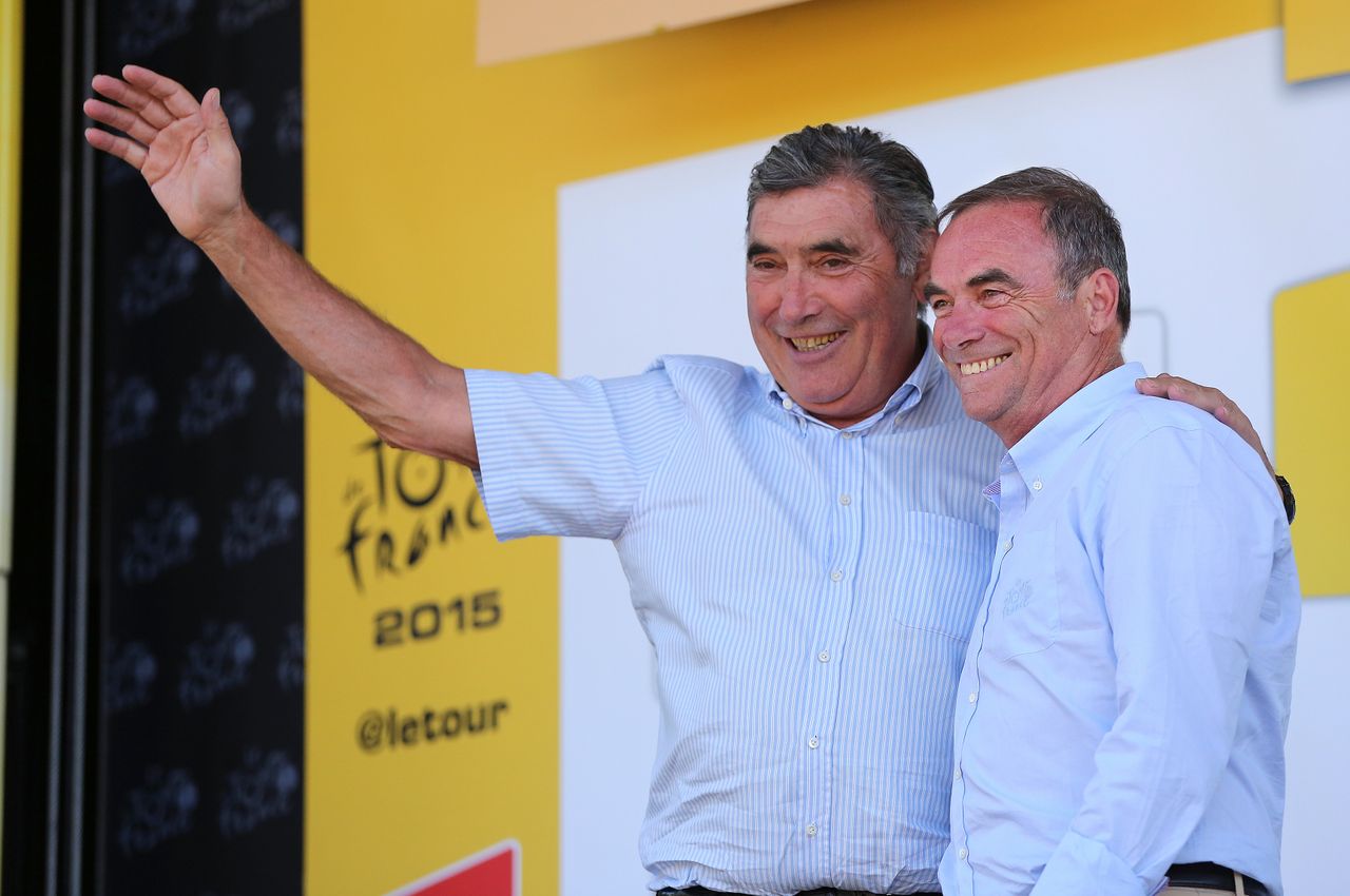 Bernard Hinault and Eddy Merckx on the Tour de France podium in 2015