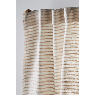 A close up of some neutral striped linen curtains