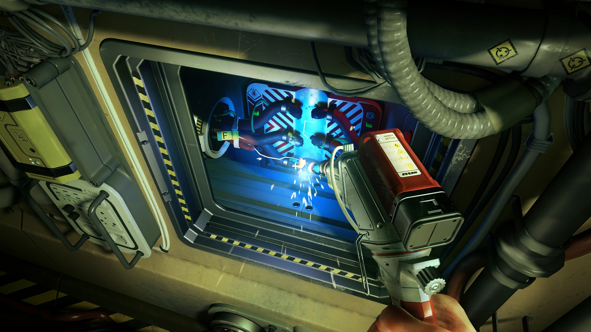 Using a handheld tool to fix sparking electrical cables in a maintenance area in Ontos