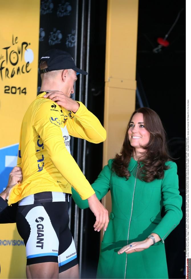The Duchess of Cambridge helps Marcel Kittel with his yellow jersey