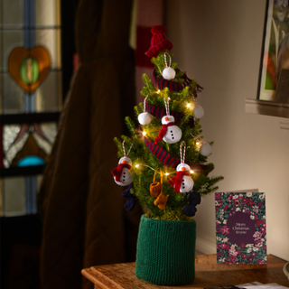 mini snowman christmas tree in hallway