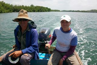 Field biologist Yairen Alonso Gimenez (right) and field assistant (left) surveying the waters for crocodiles in the wetlands of the Wildlife Refuge Monte Cabaniguan (WRMC) in southeastern Cuba.