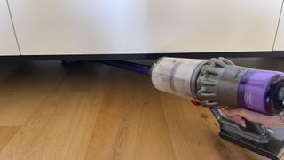 Dyson V11 cleaning under the island