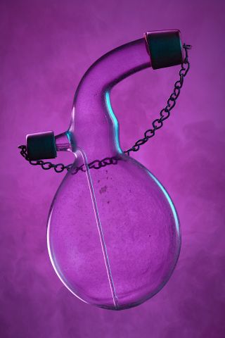 Clinical glass vessel photographed in abstract way on purple background