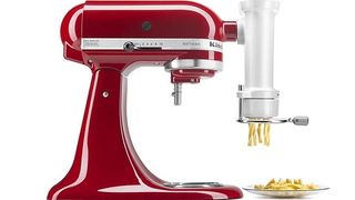 Red KitchenAid standing mixer with pasta maker attachment
