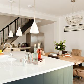 kitchen dinner room with marble worktop and wooden tray