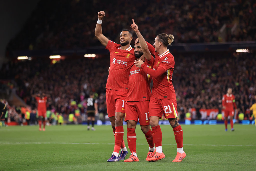 LIVERPOOL, ENGLAND - OCTOBER 2: Cody Gakpo and Mohamed Salah of Liverpool celebrates the second goal with Kostas Tsimikas during the UEFA Champions League 2024/25 League Phase MD2 match between Liverpool FC and Bologna FC 1909 at Anfield on October 2, 2024 in Liverpool, England. (Photo by Simon Stacpoole/Offside/Offside via Getty Images)