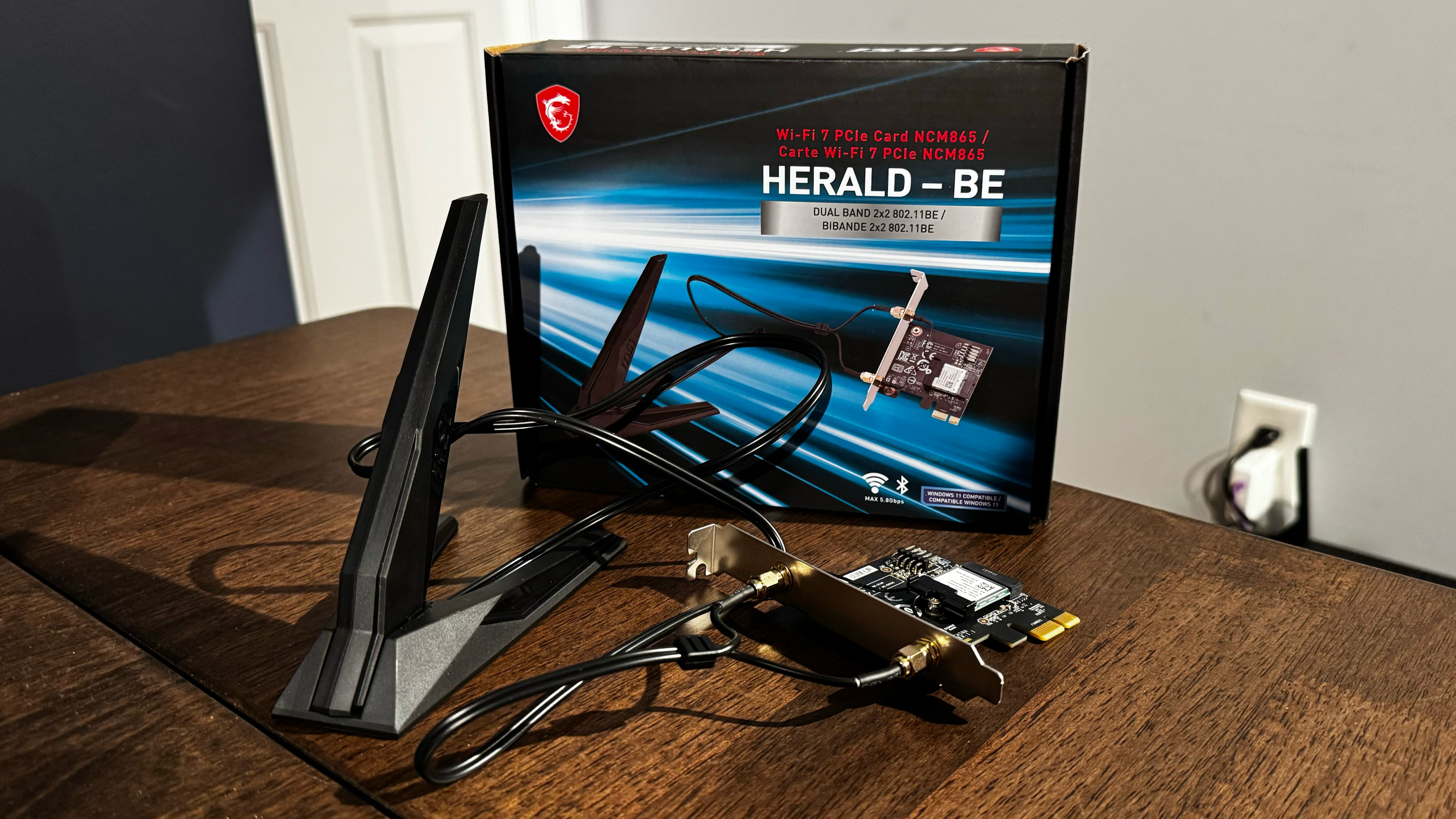 The MSI Herald-BE PCIe Add-in card on a desk and unboxed.