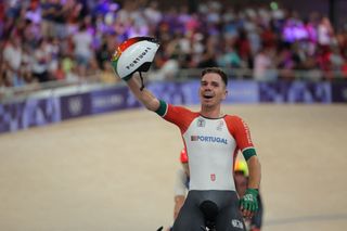 Portugal's Rui Filipe Alves Oliveira celebrates after winning the men's track cycling madison final of the Paris 2024 Olympic Games at the Saint-Quentin-en-Yvelines National Velodrome in Montigny-le-Bretonneux, south-west of Paris, on August 10, 2024. (Photo by Thomas SAMSON / AFP)