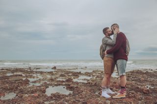 Sex dream meanings: A couple kissing on a beach