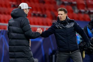 Julian Nagelsmann, Head Coach of RB Leipzig and Jurgen Klopp, Manager of Liverpool interact after the UEFA Champions League Round of 16 match between RB Leipzig and Liverpool FC at Puskas Arena on February 16, 2021 in Budapest, Hungary. Liverpool face RB Leipzig at a neutral venue in Budapest behind closed doors after Germany imposed a ban on travellers arriving from the UK in an effort to prevent the spread of Covid-19 variants. (Photo by Laszlo Szirtesi/Getty Images)