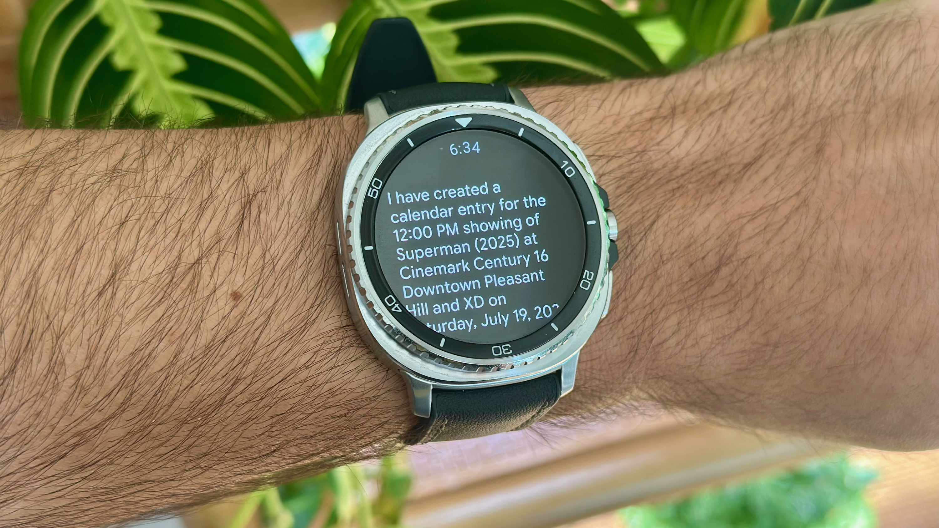The Samsung Galaxy Watch 8 Classic showing the Gemini app creating a Google Calendar entry for the movie Superman.