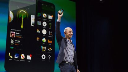 Amazon Fire Phone launch 2014 &ndash; Jeff Bezos holds up Amazon's failed smartphone