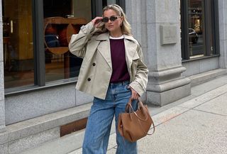 woman in cropped trench and burgundy sweater