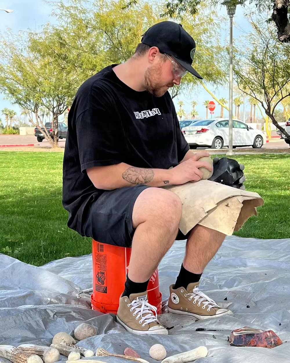 a man makes stone tools by hands
