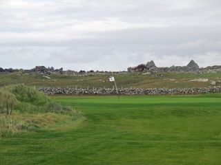 The wind sweeps across the fourth green