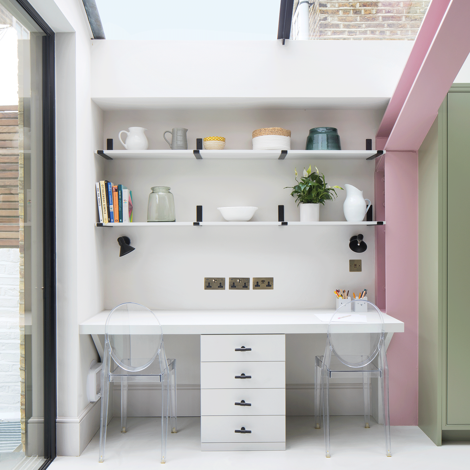 White home office in a kitchen with shelves over desk