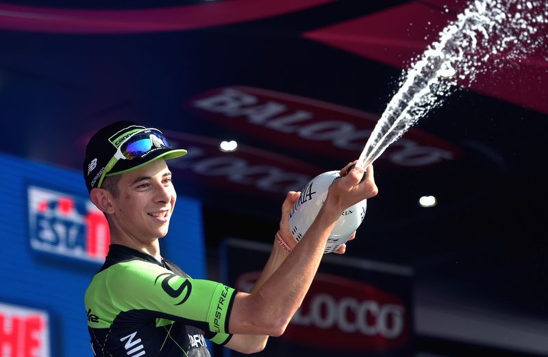 Davide Formolo looks like his arms aren't big enough to hold his celebratory prosecco