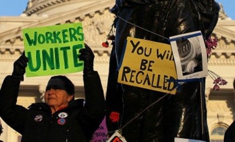 Wisconsin activists protest Gov. Scott Walker&amp;#039;s controversial budget bill that was passed Thursday in the absence of state Democrats.