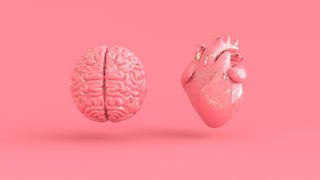 Pink brain and heart on pink background