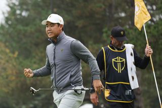 Tom Kim fist pumps at the Presidents Cup